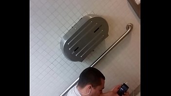 Guy caught jacking off in public restroom.